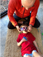 Taking a photo of childs teeth and mouth